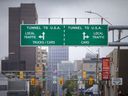 Signs directing travelers to the Detroit-Windsor Tunnel are seen on Tuesday, September 21, 2021. The US government has extended the closure of land crossings to non-essential travel due to the COVID-19 pandemic.