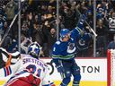 JT Miller of the Vancouver Canucks celebrates after scoring the winning goal against New York Rangers goalkeeper Igor Shesterkin during the overtime period on November 2, 2021 at Rogers Arena in Vancouver, British Columbia, Canada.