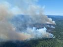 A wildfire burns southwest of Lake Deka, BC, in July 2021. College graduates have little to no formal education not just about the science of global environmental change, but about the colossal collective tasks that lie ahead, writes Keroles B. Riad and Peter Stoett.