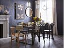 Painting your walls black or adding black furniture adds instant sophistication to a room.  Black wood dining chairs, $ 130, Homesense
