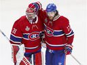 Josh Anderson of the Montreal Canadiens celebrates his goal in overtime with goalkeeper Carey Price during the Stanley Cup final against the Tampa Bay Lightning in Montreal on July 5, 2021.