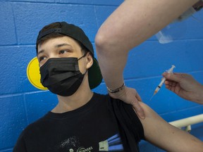 Daron Smith, 20, receives his COVID-19 vaccine while in a pop-up vaccination clinic at the Windsor Essex Community Health Clinic on Monday, May 17, 2021.