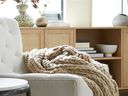 A cozy blanket in a neutral color is the perfect home gift.  Naked chunky knit shot, $ 40, HomeSense.ca