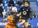 CF Montréal's Ahmed Hamdi, right, challenges Dynamo's Tim Parker during the first half at Saputo Stadium on Wednesday.