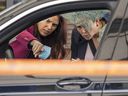 Police investigators look through the window of a smashed car after a recent shooting on the eastern edge of Montreal.  While most of the weapons seized in Toronto are smuggled, this is not true for Quebec, writes Heidi Rathjen.