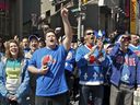 Fans of Quebec Nordiques react to a billboard they rented in Times Square in New York City on April 9, 2011, to pressure the NHL to place a team in Quebec City.   