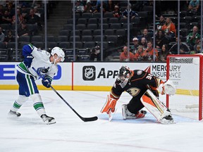 Canucks center Elias Pettersson is stoned by Anaheim Ducks goalie John Gibson during a National Hockey League game on November 14, 2021 at the Honda Center in Anaheim, California.