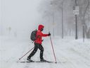 A cross country skier crosses Park Ave. during the Montreal snow storm.