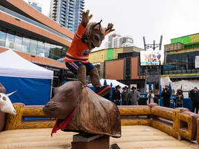 Hunter, the Edmonton Oilers mascot, rides during the Official PBR Mechanical Bull Challenge for the 2021 PBR Canada National Finals outside of Rogers Place in Edmonton, Friday, Nov. 12, 2021. Photo by Ian Kucerak
