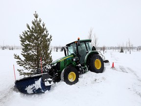 A piece of Edmonton snow clearing equipment is seen stuck in the snow by the side of a bike lane near the Meadows Recreation Center, 2704 17 St., in Edmonton, on Tuesday, Nov. 16, 2021. Ban on City of Edmonton phase 1 parking will begin at 7 p.m. and will remain in effect until the city has cleared major highways, such as arteries and collector roads, as well as expressways, bus routes, and posted highways. 