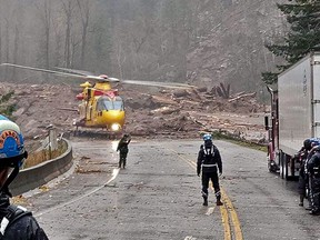 Mike Stronach, a Langley firefighter, and his 12-year-old daughter were airlifted from the landslide area aboard an RCAF Cormorant helicopter with hundreds of other people trapped by a double freeway landslide.  7