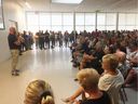 Lakeshore Managing Director Truper McBride, left, speaks to a large crowd during a flood update meeting hosted by the Essex Region Conservation Authority on Monday, Aug. 12, 2019.