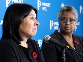 Valérie Plante, left, speaks as Dominique Ollivier watches during a press conference in Montreal, Tuesday, Nov. 2, 2021.