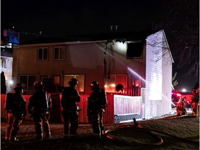 Firefighters with the Edmonton Fire Rescue Service fight a condominium fire on Lee Ridge Road and Millbourne Road East in Mill Woods, Wednesday night, Nov. 10, 2021.