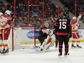 The flames last night celebrated a goal by Andrew Mangiapane (right) against the Senators at the CTC.