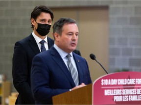 Prime Minister Justin Trudeau (left) listens as Alberta Prime Minister Jason Kenney answers a question about climate change policy during a joint federal-provincial announcement for a $ 10-a-day daycare on Boyle Street Plaza in Edmonton, on Monday, November 15, 2021. Photo by Ian Kucerak