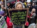 Orla Dean, 5, holds a sign during the Time's Up rally on Richmond Terrace, opposite Downing Street, on January 21, 2018 in London, England.  The Time's Up Women's March marks the first anniversary of the first Women's March in London and in 2018 is inspired by the Time's Up movement against sexual abuse.  The Time's Up initiative was launched in early January 2018 in response to the #MeToo movement and the Harvey Weinstein scandal.