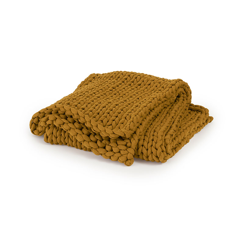 A folded chunky knit blanket from Bearaby