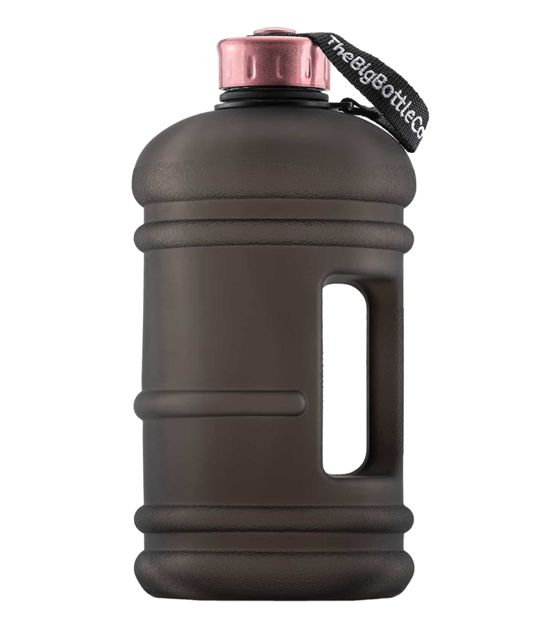 A large brown water bottle with a pink cap.