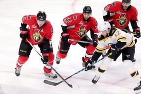 Left to Right: Senators Dion Phaneuf, Chris Kelly and Clarke MacArthur battle the Bruins in the 2017 playoffs. Not only were Phaneuf and MacArthur teammates, they are also close cousins.  WAYNE CUDDINGTON ARCHIVES / POSTMEDIA