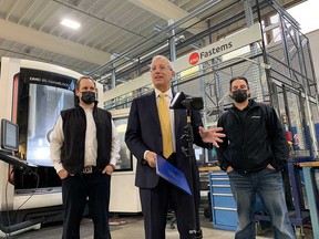 Vic Fedeli (center), Ontario's minister of economic development, talks about how provincial grants have benefited the automated manufacturing of Lakeshore-based tool and mold company CNCTech.com owned by Donny Butler (left) and his brother Kevin Butler (right).  Photographed on November 16, 2021.