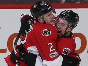 Former Senators defender Dion Phaneuf celebrates with Mark Stone after Phaneuf scored in overtime to win Game 2 against the Boston Bruins in the 2017 playoffs. FILES TONY CALDWELL / SUN