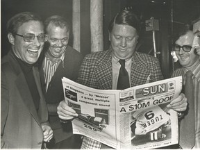 Former editor Doug Creighton (left) holds the first copy of The Toronto Sun on November 1, 1971 with Ray Biggart (center) and Peter Worthington and general manager Don Hunt on the left.