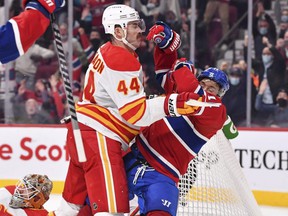 Calgary Flames defender Erik Gudbranson takes down Canadiens forward Brendan Gallagher on Thursday night.  FAKE IMAGES