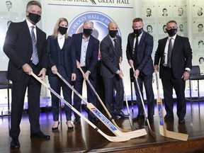 The six members of this year's Hockey Hall of Fame received their rings at a ceremony yesterday at the Hockey Hall Grand Hall in Toronto: Pictured from left to right are players Doug Wilson, Kim St-Pierre, Kevin Lowe, Jarome Iginla , Marian Hossa and Ken Holland for the category of constructors.  Jack Boland / Toronto Sun