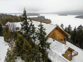 View of the lake from the Hotel Sacacomie, a sprawling white pine log cabin-style structure in Saint-Alexis-des-Monts, Que.