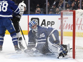 Trevor Moore of the Los Angeles Kings scores a goal over Maple Leafs goalkeeper Jack Campbell in the first period.  DAN HAMILTON / USA TODAY SPORTS