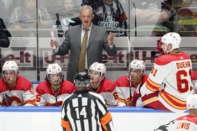 Calgary Flames head coach Darryl Sutter argues with a referee during a game.  AP PHOTO