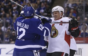 Dion Phaneuf, then a member of the Ottawa Senators, negotiates jousts with former Maple Leaf Patrick Marleau in 2018. JACK BOLAND / SUN FILES