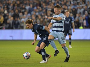 Vancouver Whitecaps goalkeeper Maxime Crepeau concedes a goal to Sporting Kansas City forward Khiry Shelton (not pictured) during the first half of an MLS Playoff Round 1 game at Children's Mercy Park.