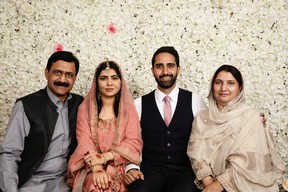 Nobel Peace Prize winner Malala Yousafzai sits next to her husband Asser in a picture posted with a social media post announcing her marriage, in Birmingham, Britain, on November 9, 2021. Twitter @ Malala