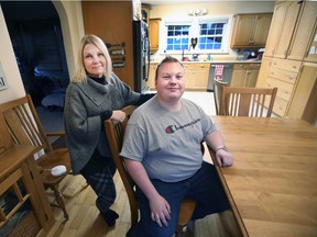 Dawn Bezaire is shown with her 22-year-old son Jeremy Bezaire at their home in Harrow on Thursday, November 11, 2021. Jeremy, who works full-time, would like to move out of his parents' house but is struggling to find one. affordable housing.  .
