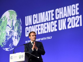 French President Emmanuel Macron speaks during a plenary session as part of the World Leaders Summit of the United Nations Conference on Climate Change COP26 in Glasgow on November 1, 2021. - COP26, to be held from 31 from October to November 12 in Glasgow, it will be the biggest climate conference.  since the 2015 Paris summit and is seen as crucial for setting global emissions targets to curb global warming, as well as for securing other key commitments (Photo by ALAIN JOCARD / AFP)