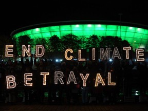 Youth activists hold letters in Glasgow during the COP26 Climate Change Conference this week.