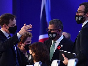 Britain's COP26 President Alok Sharma, center, looks on before an informal stocktaking plenary session during the UN Climate Change Conference at COP26 in Glasgow on November 13, 2021.