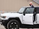 US President Joe Biden drives a GMC Hummer EV while touring the General Motors Factory ZERO electric vehicle assembly plant in Detroit, Michigan, on November 17, 2021.