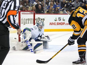 Zach Aston-Reese (12) of the Pittsburgh Penguins takes a shot that outstrips Vancouver Canucks goalkeeper Thatcher Demko (35) for a goal during the second period of an NHL hockey game in Pittsburgh, Wednesday, November 24. of 2021.