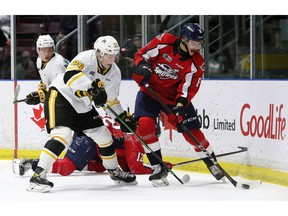 Windsor Spitfires' Nathan Ribau, right, fights Sarnia Sting's Alex Geci in the first period at the Progressive Auto Sales Arena in Sarnia, Ontario on Friday, Nov. 12, 2021. Mark Malone / Chatham Daily News / Postmedia Network