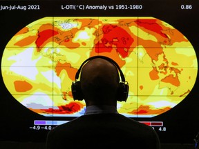 A delegate looks at a screen during the United Nations Climate Change Conference (COP26) in Glasgow, Scotland, Great Britain, on November 8, 2021.