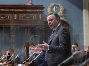 Prime Minister François Legault responds to a question from the opposition about the report by the ombudsman Marie Rinfret and the management of the first wave of the COVID-19 pandemic in the homes of the elderly, during the question period in the Legislature in Quebec City, Wednesday, November 24, 2021.