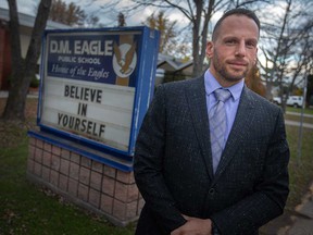 Mario Spagnuolo, president of the Ontario Elementary Teachers Federation in Greater Essex, stands in front of the DM Eagle Public School in Tecumseh on November 18, 2021.