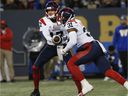 Montreal Alouettes quarterback Trevor Harris surrendered to running back William Stanback during the first half against the Winnipeg Blue Bombers in Winnipeg on November 6, 2021.
