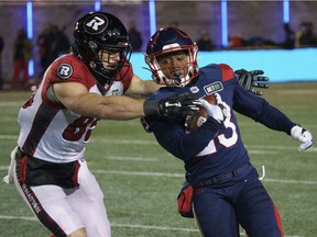 Alouettes 'Martese Jackson tries to outflank the Redblacks' Kenny Stafford during a kick return in the first quarter Friday night at Molson Stadium.