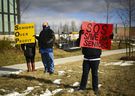 People protest in front of the Tendercare Living Center long-term care facilities during the COVID-19 pandemic in Scarborough, Ontario on Tuesday, December 29, 2020. This LTC home has been hit hard by the coronavirus during the second wave.  THE CANADIAN PRESS / Nathan Denette