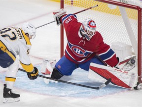 Montreal Canadiens goalkeeper Sam Montembeault saves Ryan Johansen of the Nashville Predators during the first period in Montreal on November 20, 2021.