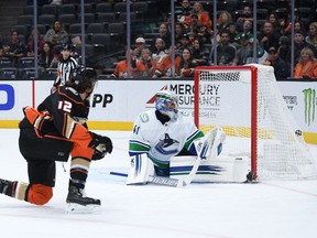 Anaheim Ducks left wing Sonny Milano (12) scores a goal past Vancouver Canucks goaltender Jaroslav Halak (41) during the second period at the Honda Center.
